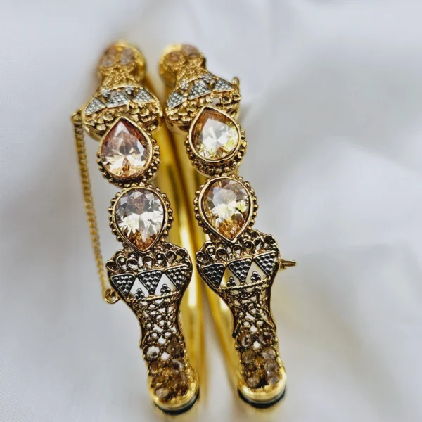 GOLD BANGLES.